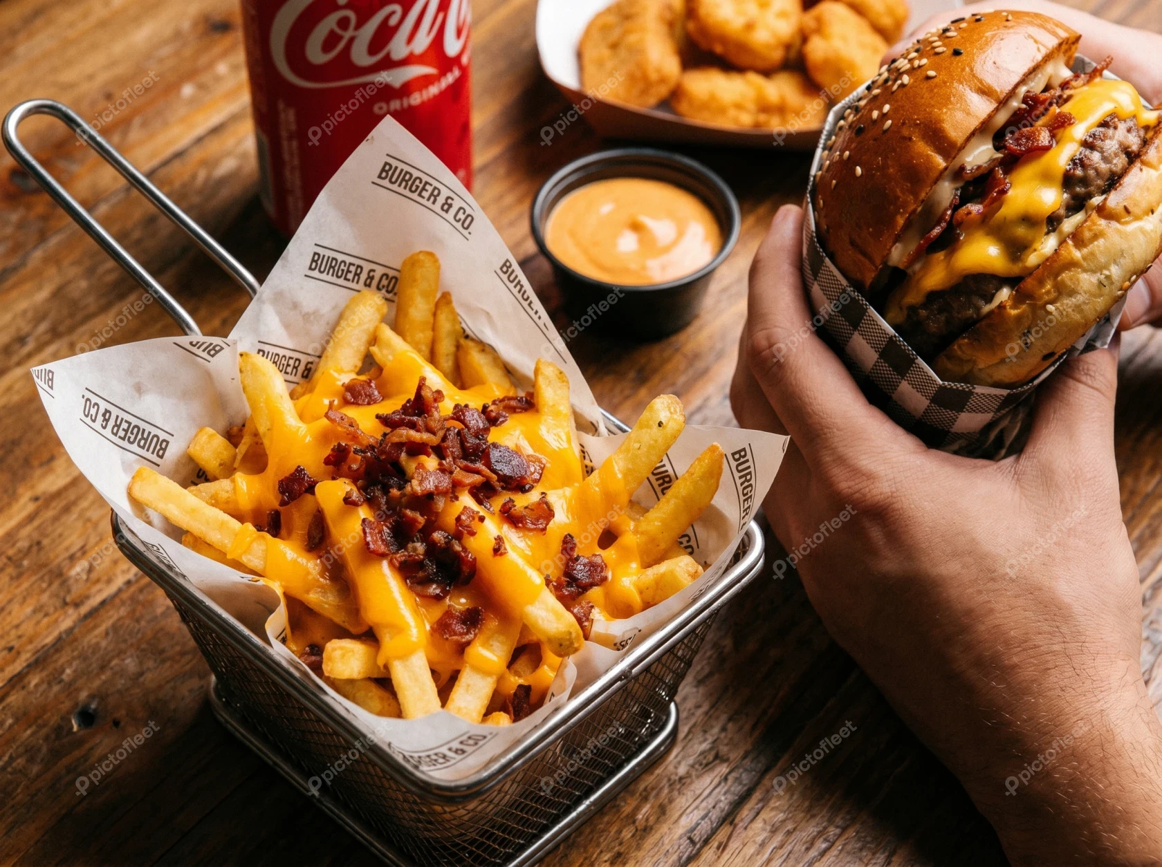 Fast food meal with cheeseburger, loaded fries, and nuggets