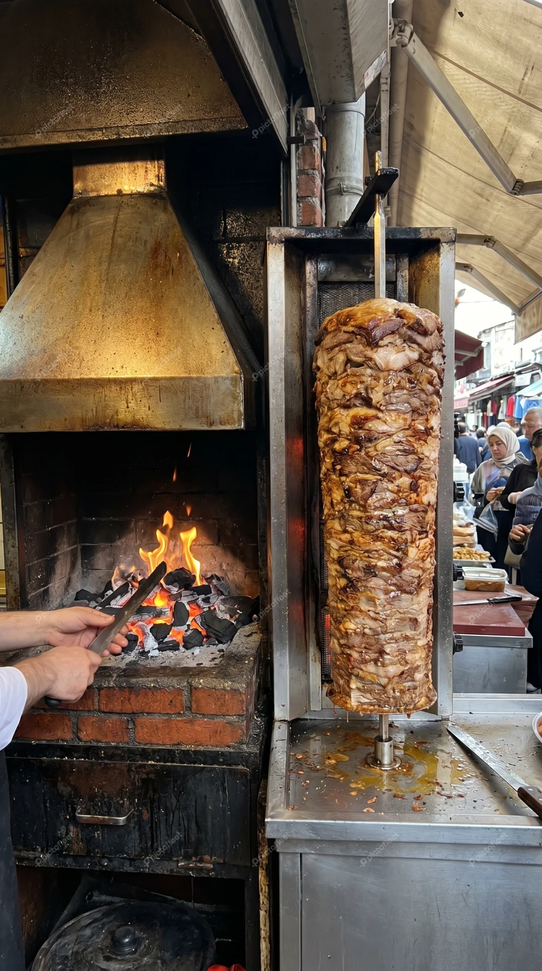 Traditional Turkish doner kebab cooking over a charcoal fire