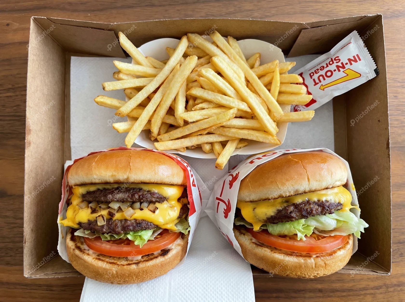 Two In-N-Out cheeseburgers and a large order of fries