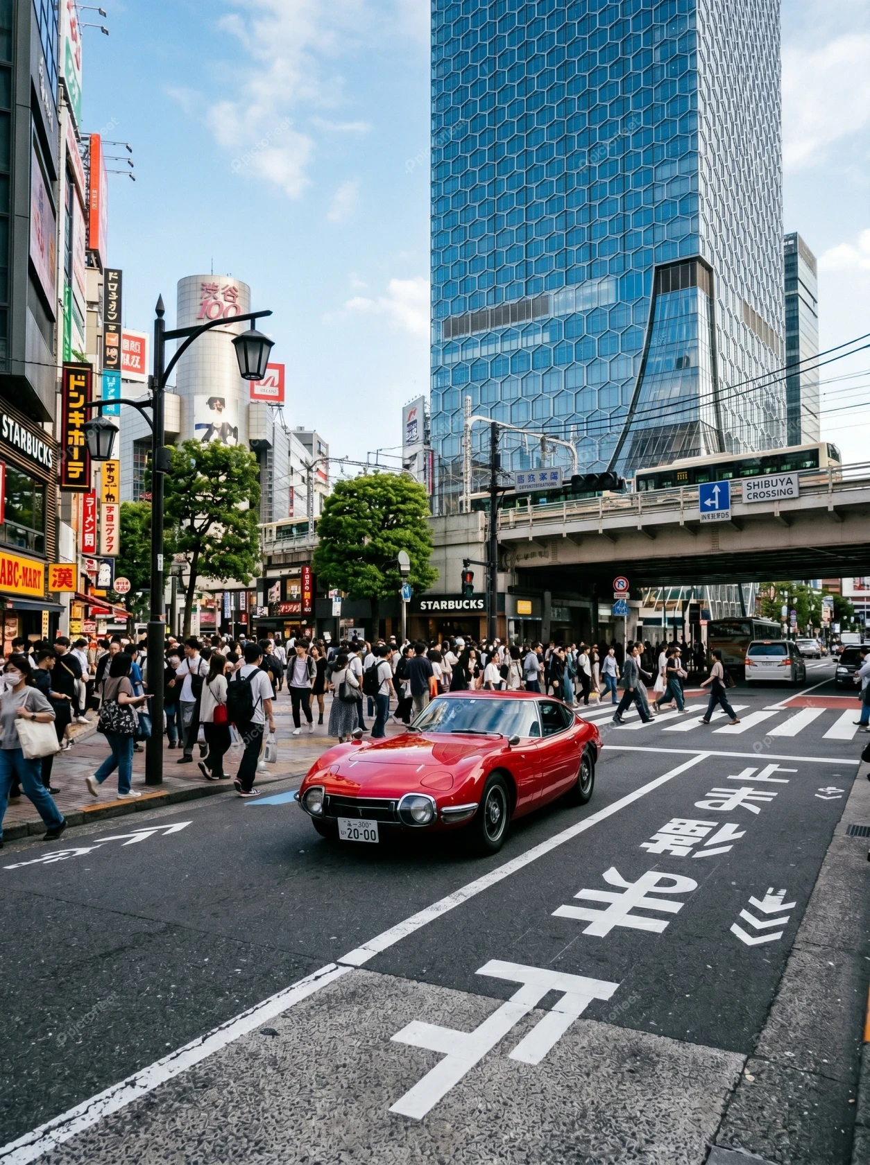 Classic red sports car on busy Tokyo city street