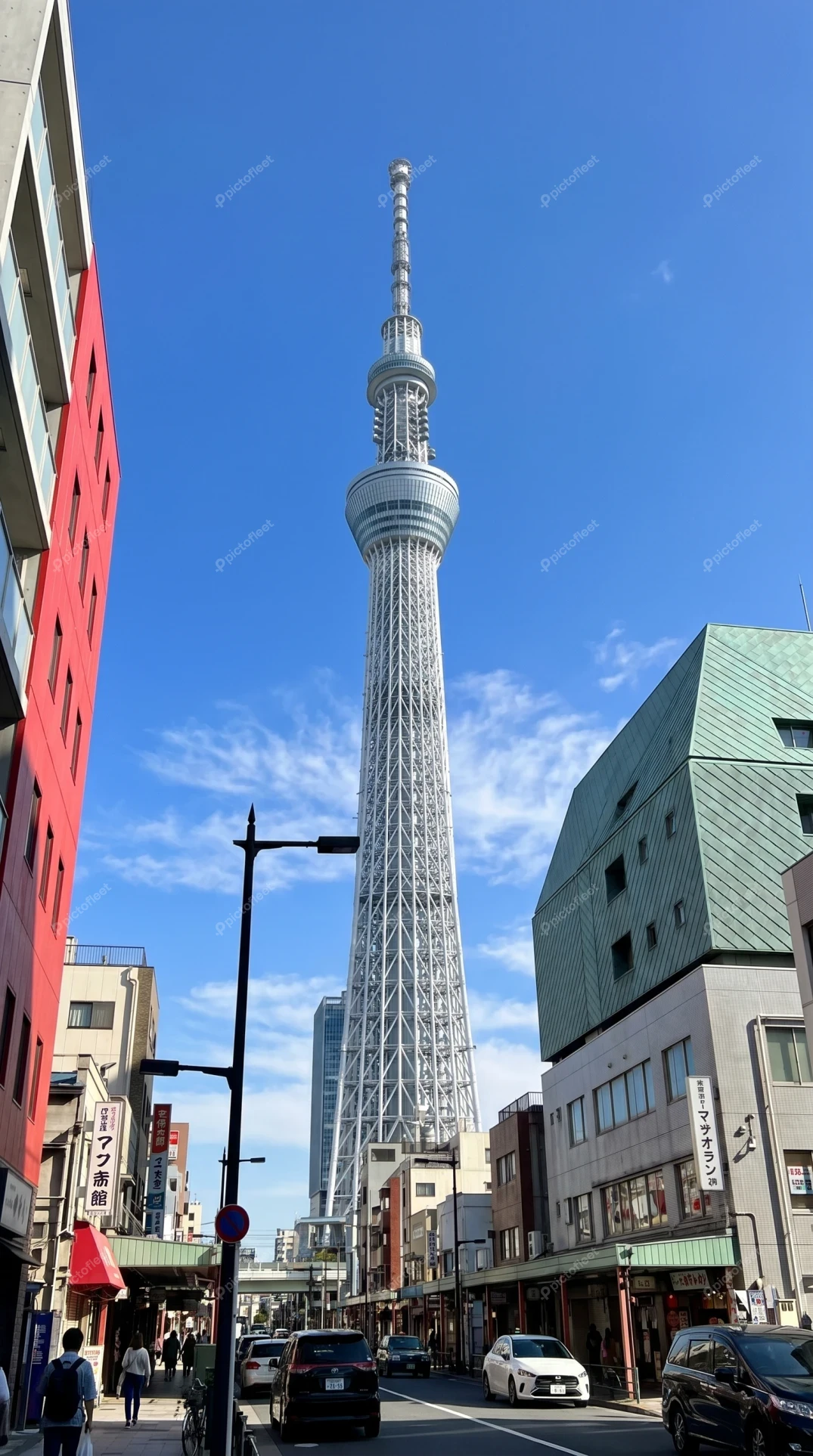 Tokyo Skytree landmark towering over a city street in Japan