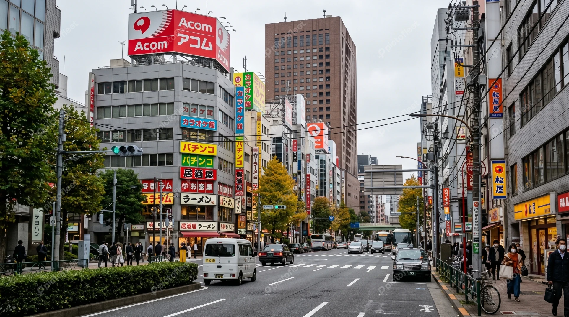 Busy urban street with colorful billboards in Tokyo, Japan
