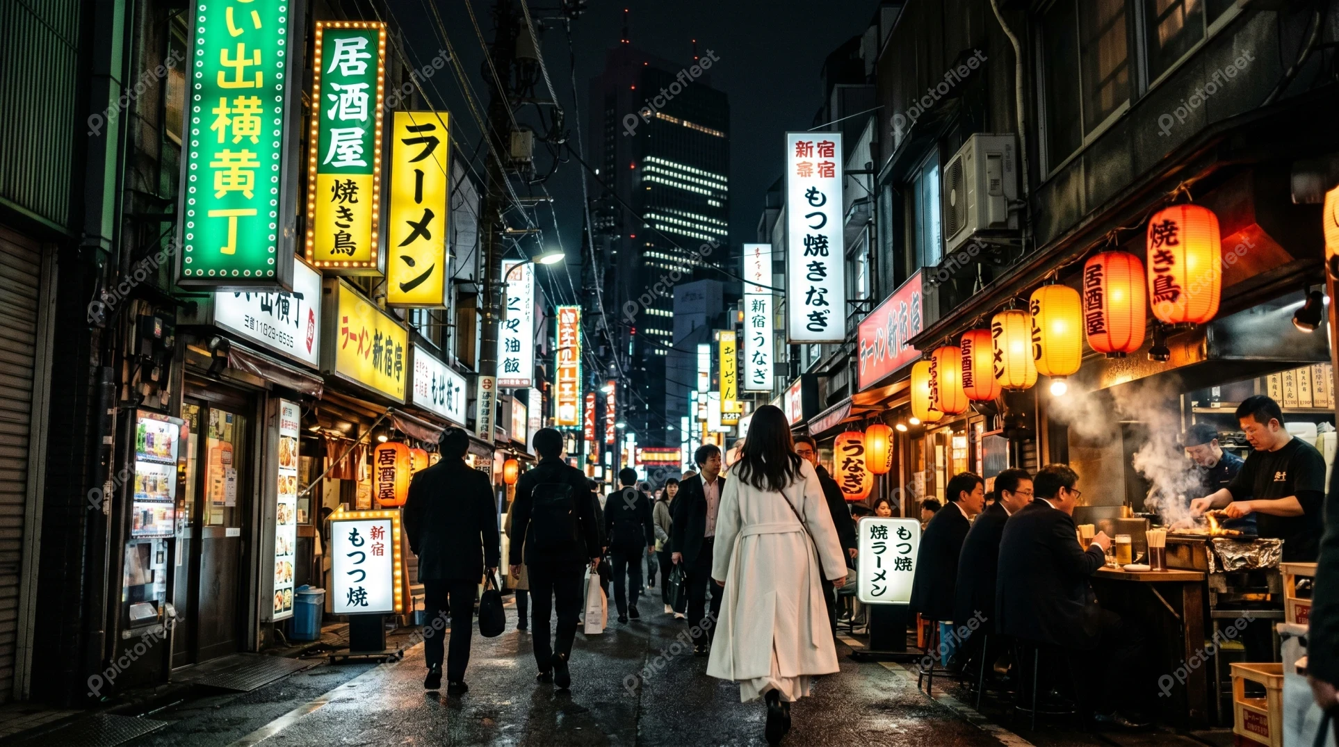 Busy Shinjuku Omoide Yokocho alley at night in Tokyo