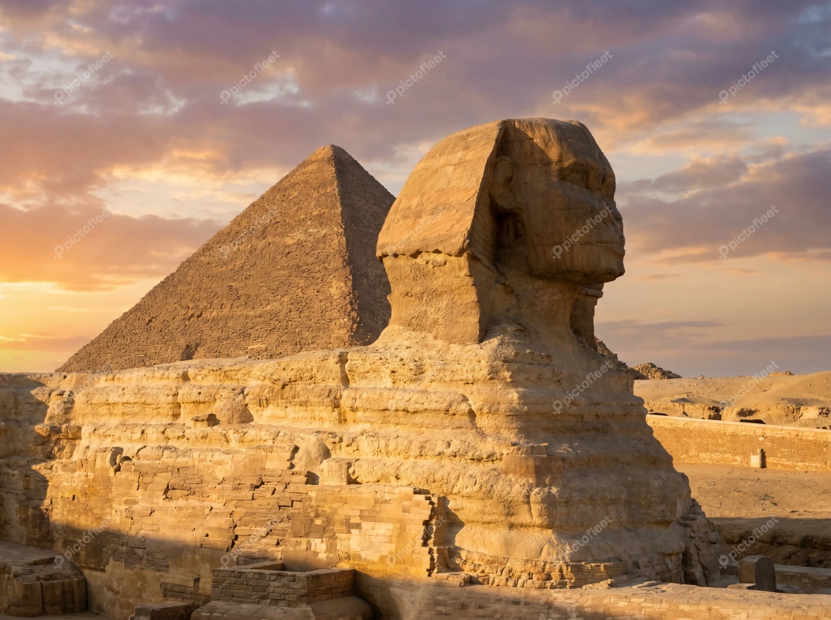 Great Sphinx and Pyramid of Giza at sunset