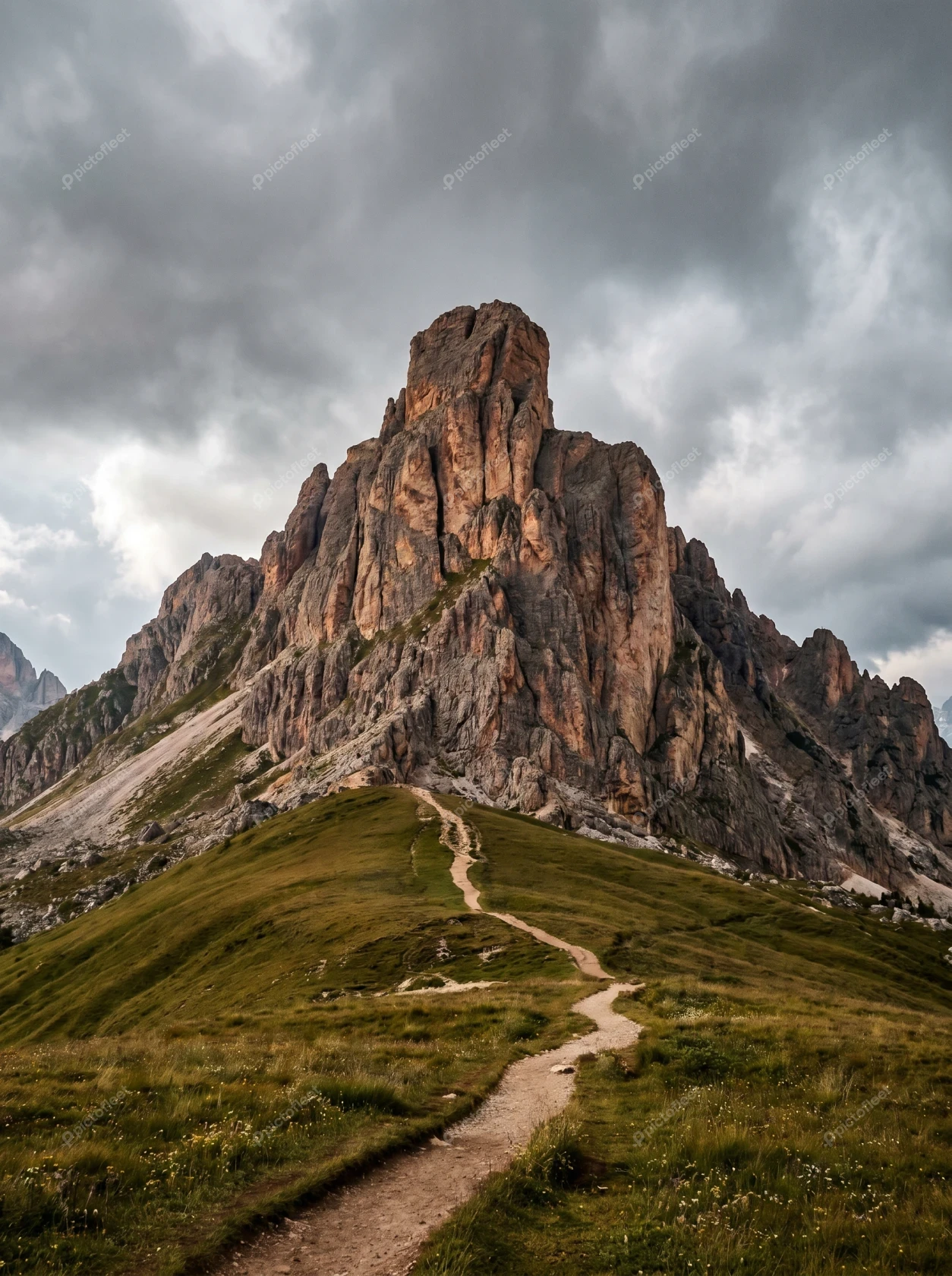Winding hiking path leading to Ra Gusela peak, Dolomites Italy