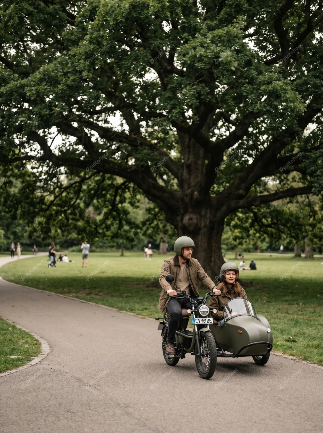 Couple riding a vintage motorcycle with sidecar through park