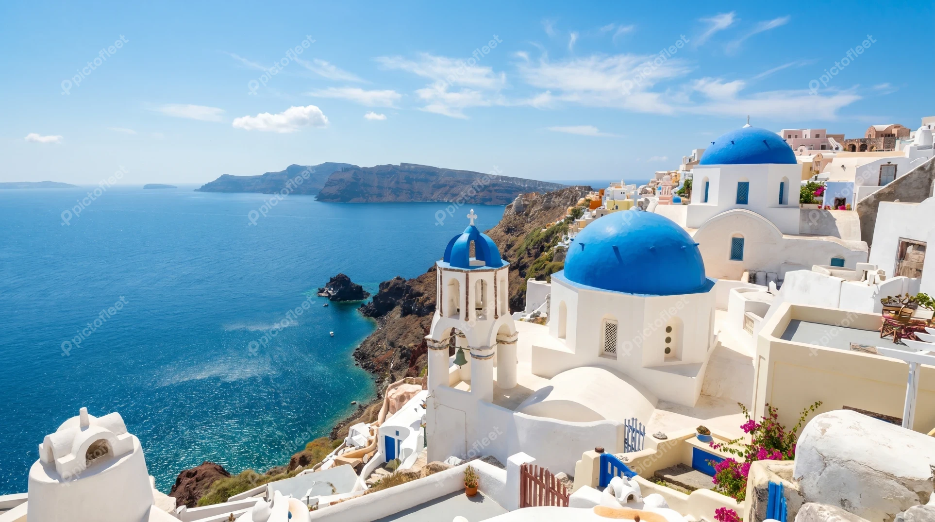 Blue domed churches in Oia village on Santorini island
