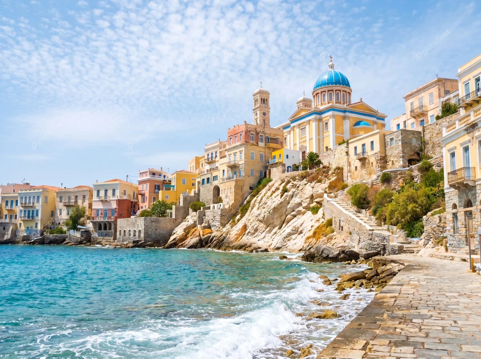 Scenic coastal view of Ermoupoli with blue domed church